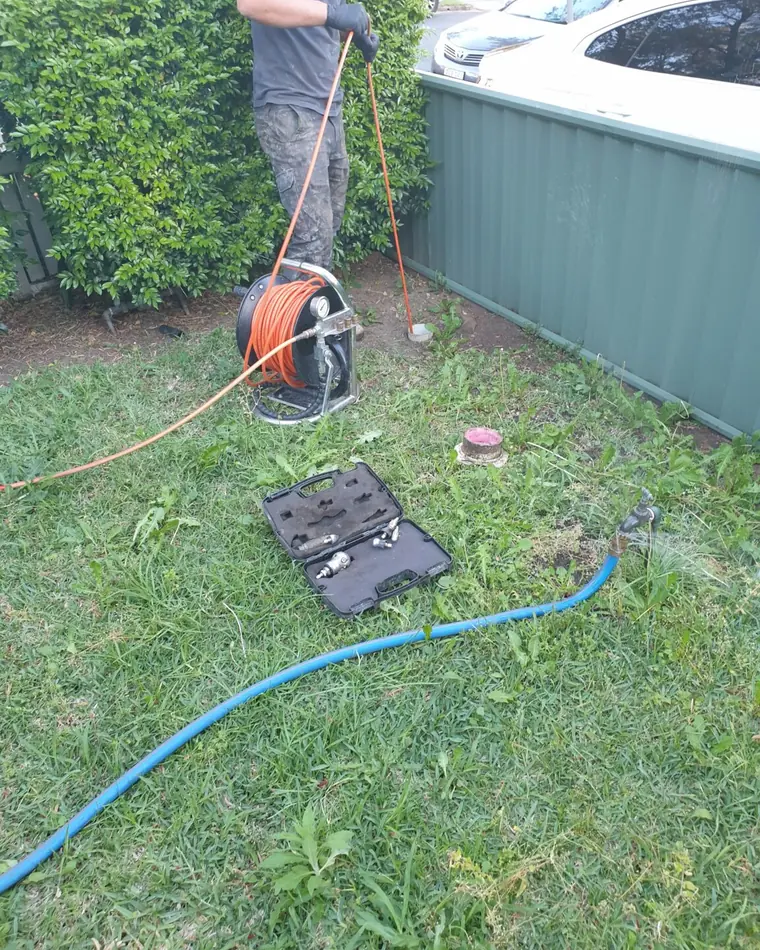 Drain clearing equipment set up on a Sydney job site
