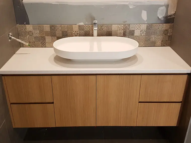 Timber vanity with above-counter basin and mixer installed