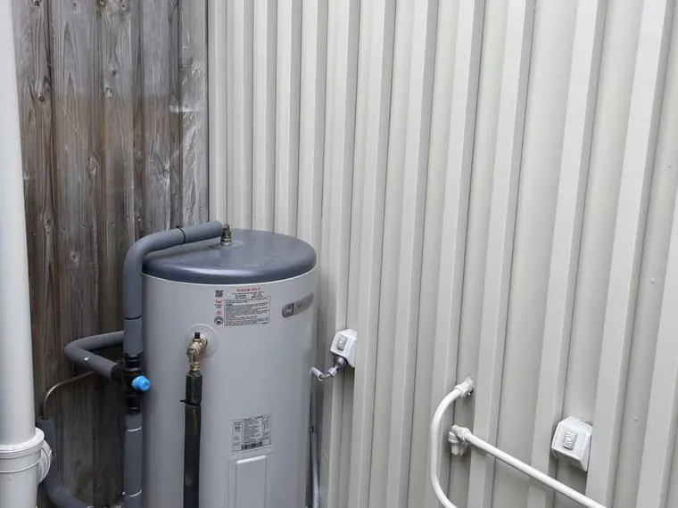 Replacement hot water system installed with new pipework and relief drain